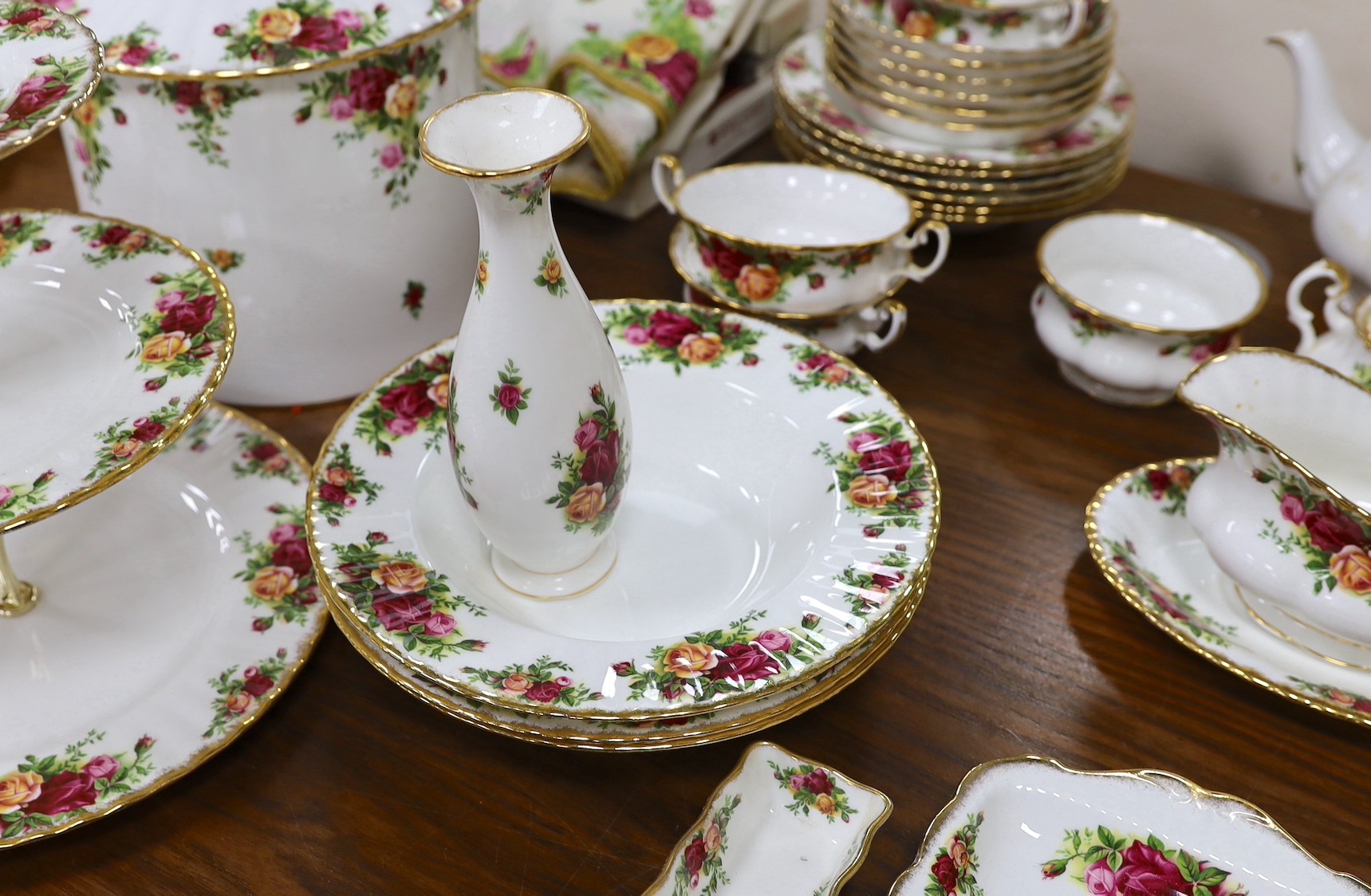 Royal Albert Old Country Rose dinner and tea service, to include a large biscuit box three tier cake stand etc